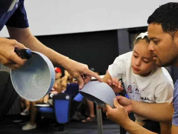 Father-and-Daughter-learn-about-the-moon-in-Flandrau-Planetarium-in-Tucson 