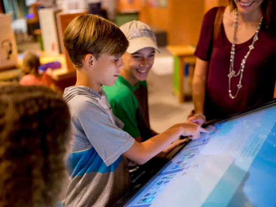 Children playing a digital game at flandrau