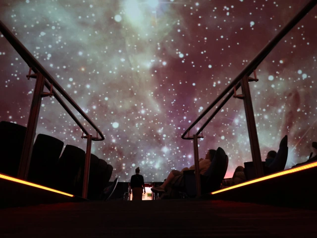 People in planetarium enjoying hubble images