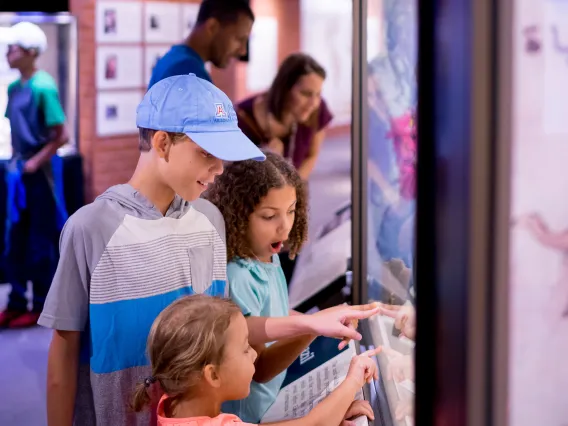 Family visiting exhibits at Flandrau science center