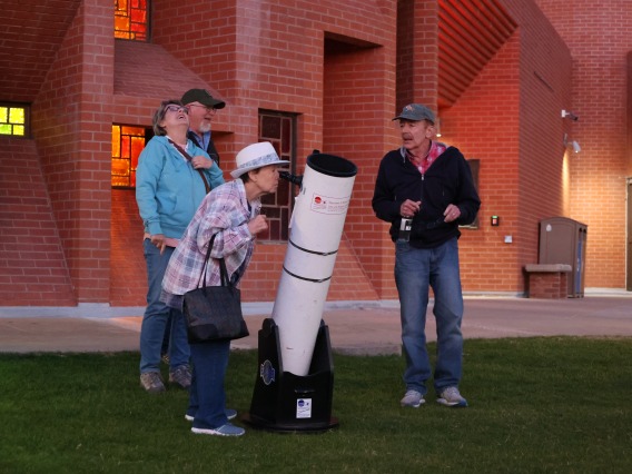 People peering through telescopes at Flandrau
