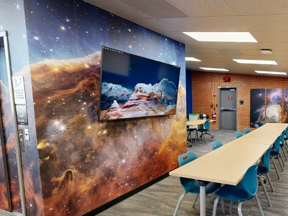 Classroom with galaxy artwork on walls