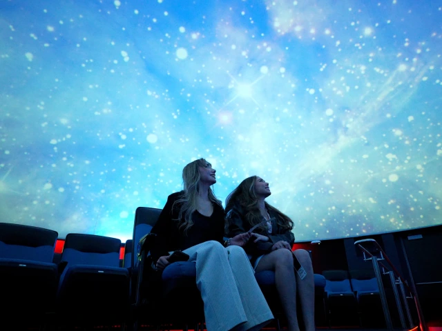 two young women in flandrau planetarium