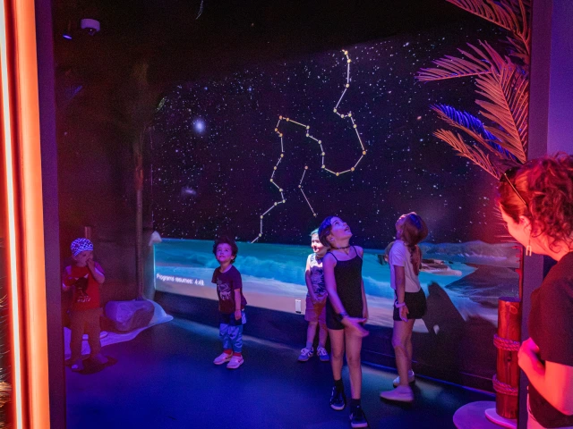 Kids experience constellations at Flandrau planetarium