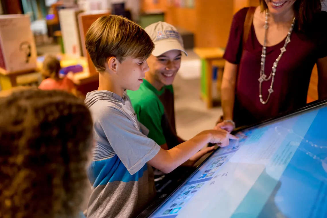 Children playing a digital game at flandrau