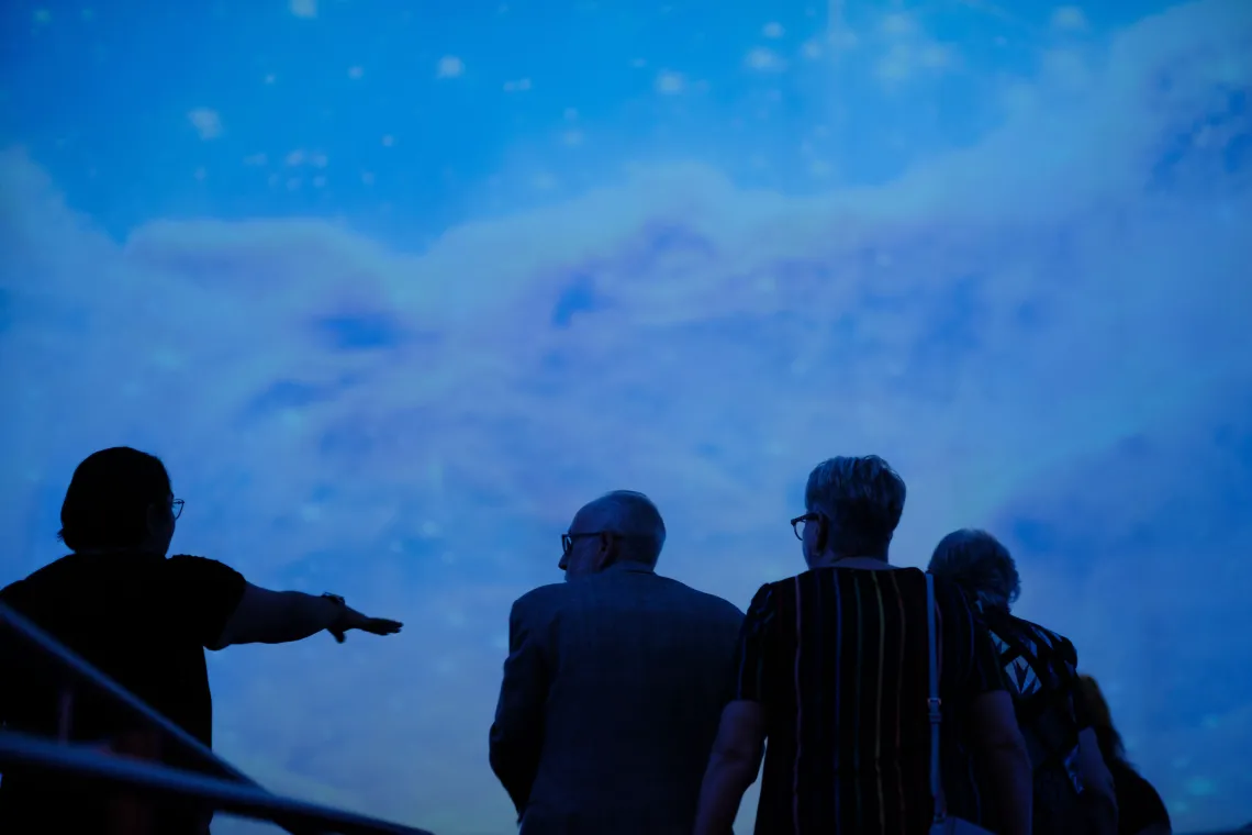 Guests being seated inside planetarium