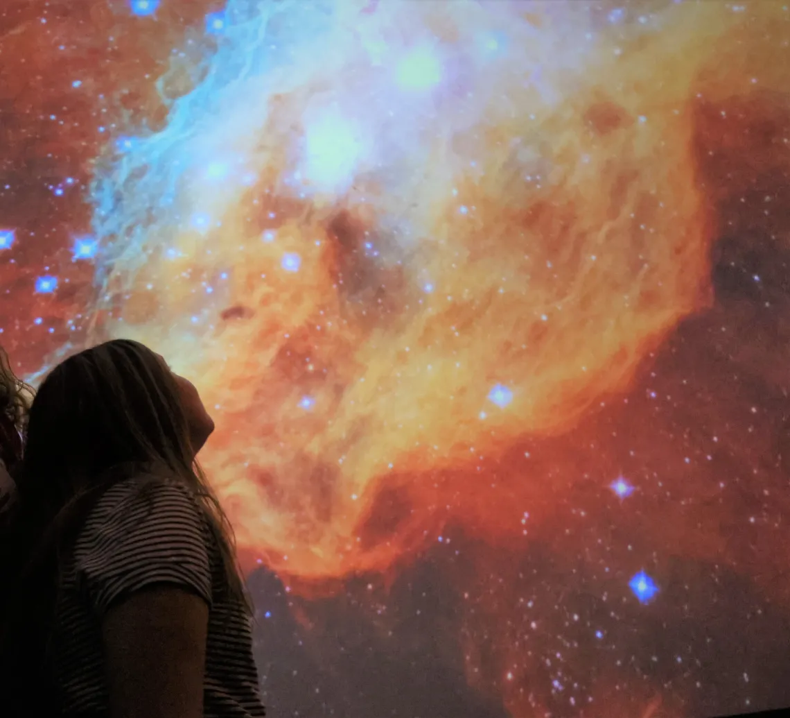 Child looking up at Flandrau planetarium