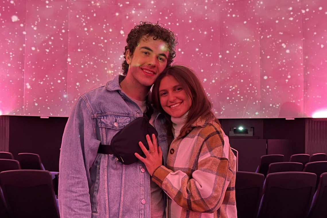 Couple inside planetarium