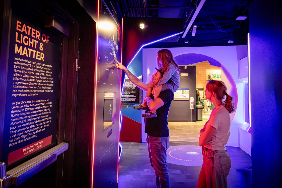 family sees astronomy exhibit in tucson at flandrau