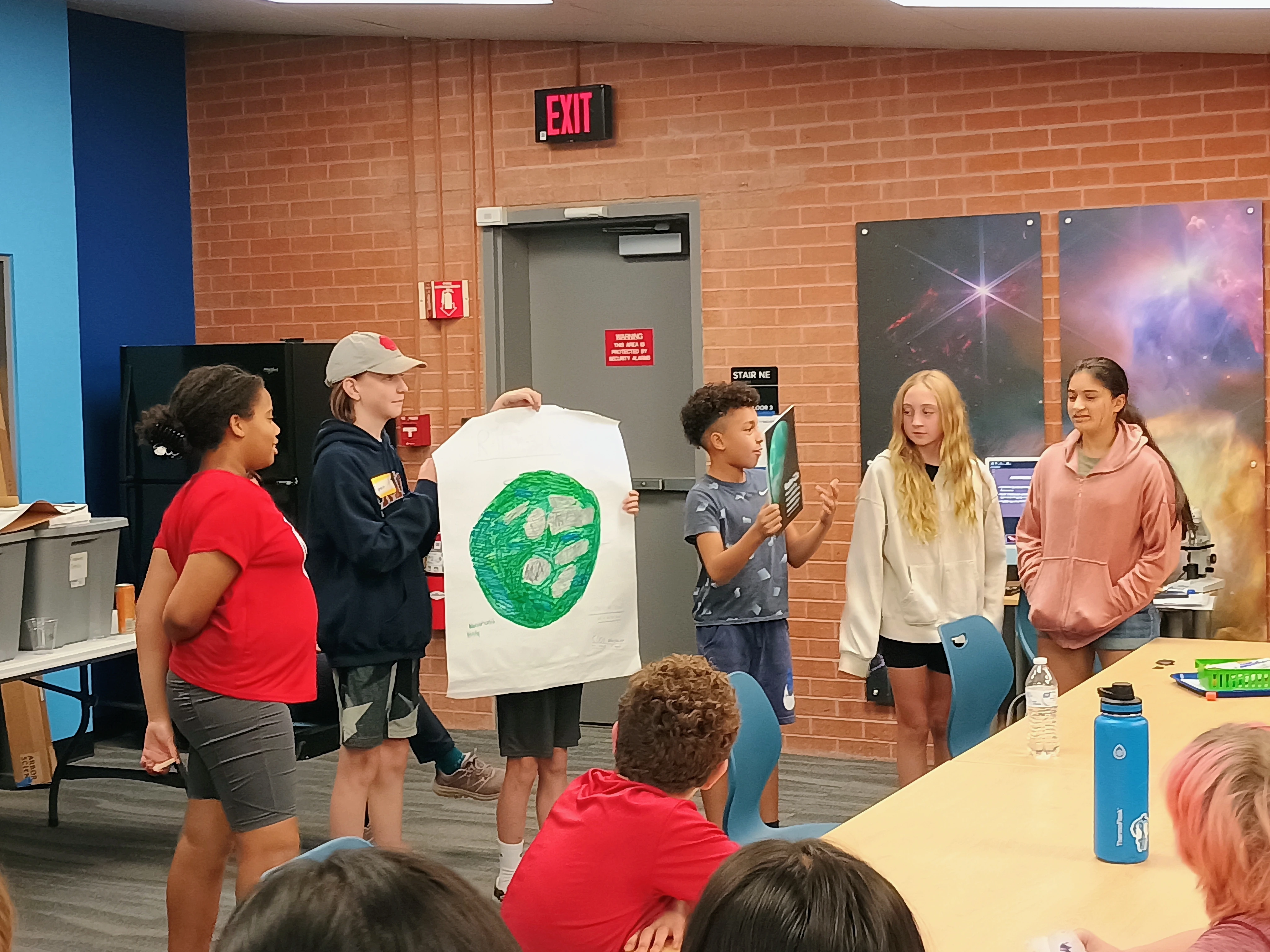 Students present their planet poster