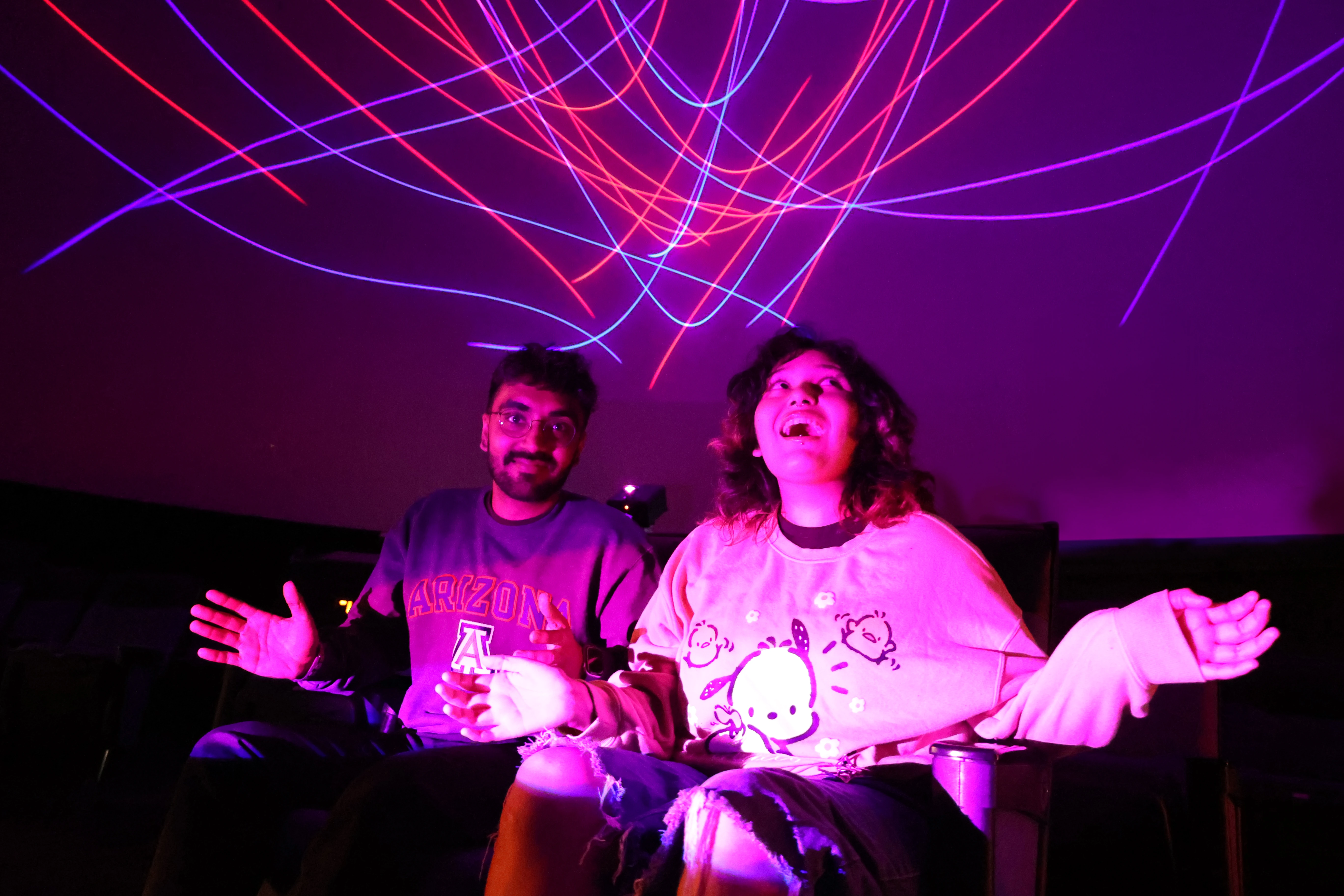 Young Adults at Flandrau laser Show