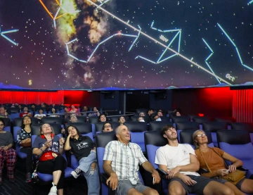 Families enjoying Flandrau planetarium show