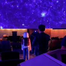 Little girl in purple planetarium dome