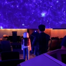 Little girl in purple planetarium dome