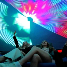 two young women in flandrau planetarium at a laser show