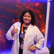 Staff member at Flandrau Science Center & Planetarium giving a thumbs up